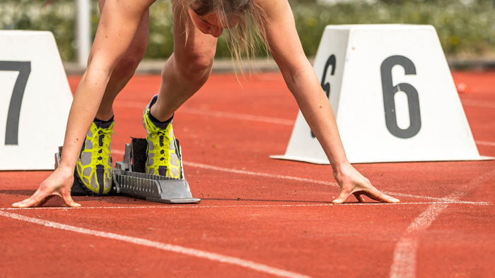 woman about to run on the track