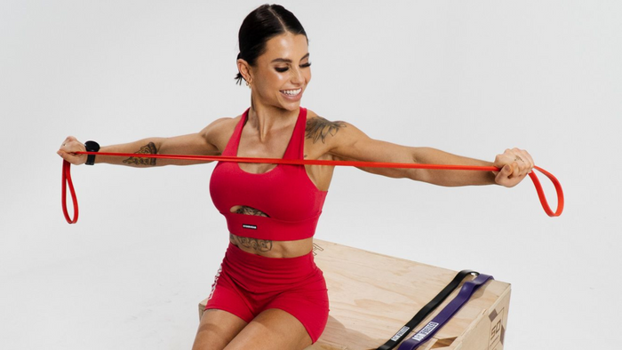 woman holding resistance bands